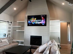 L cove TV install over fireplace