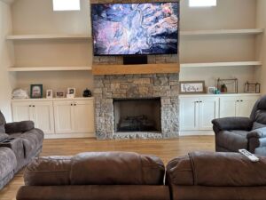 TV installed on stone with surround sound